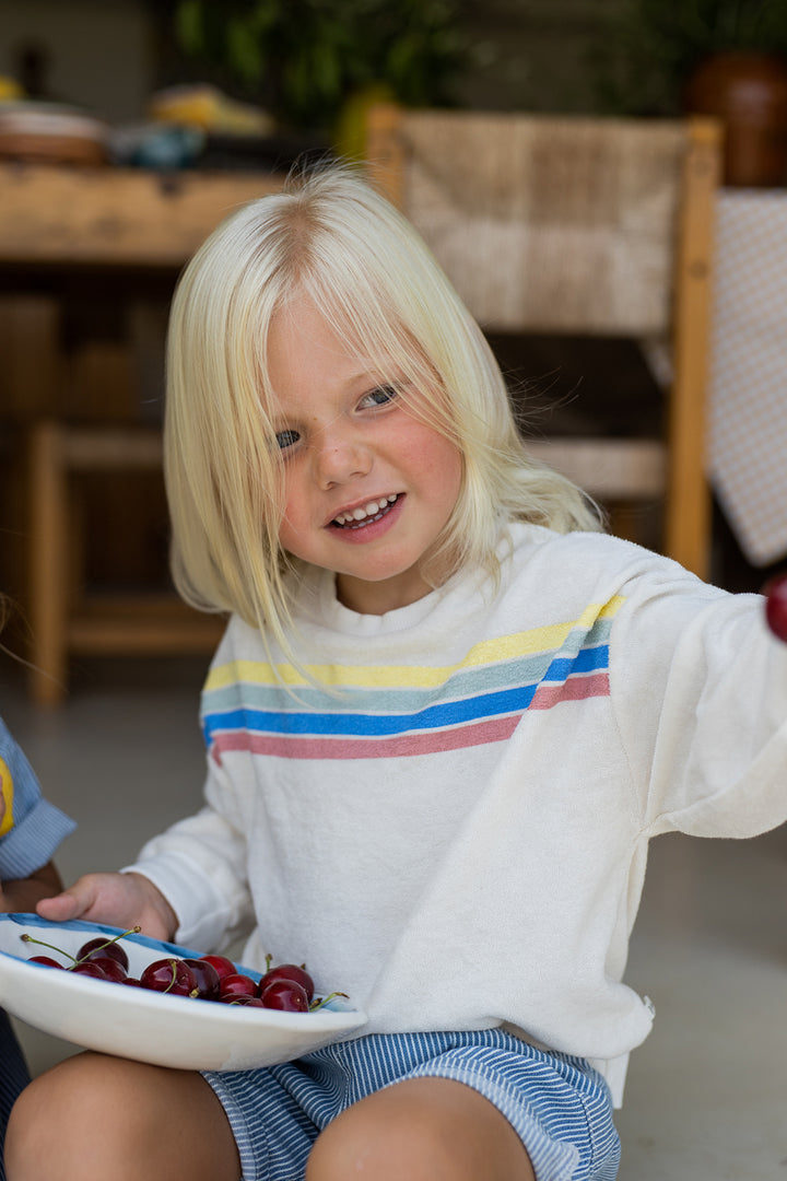 1+ in the family Santanyi off-white getragen von einem Kind, Ansicht von vorne