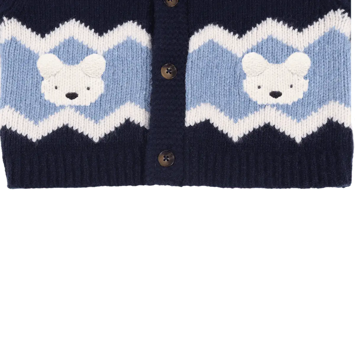 Donsje Kwinten Merino Wool Cardigan Polar Bears navy blue Detailansicht unterer Saum mit hellblauem und weißem Streifen und den eingestrickten Eisbären-Gesichtern. 
