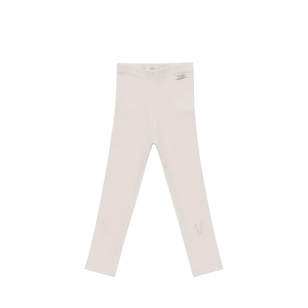 hellrosafarbene Leggings für Mädchen aus Bio-Baumwolle in gerippter Struktur mit einem aufgestickten Einhorn-Gesicht unterhalb des linken Knies