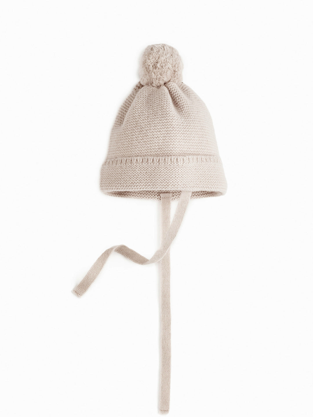 Bommelmütze für Babys aus Merinowolle und Kaschmir in beige mit Bindeband