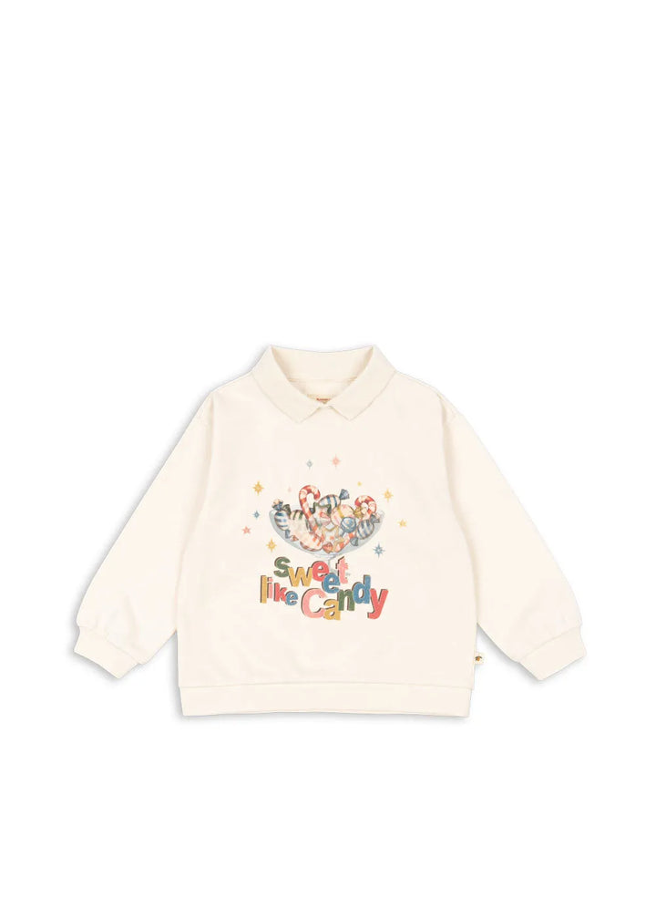 cremefarbenes Poloshirt für Mädchen aus Bio-Baumwolle mit Kragen und buntem Weihnachtsbonbon-Motiv