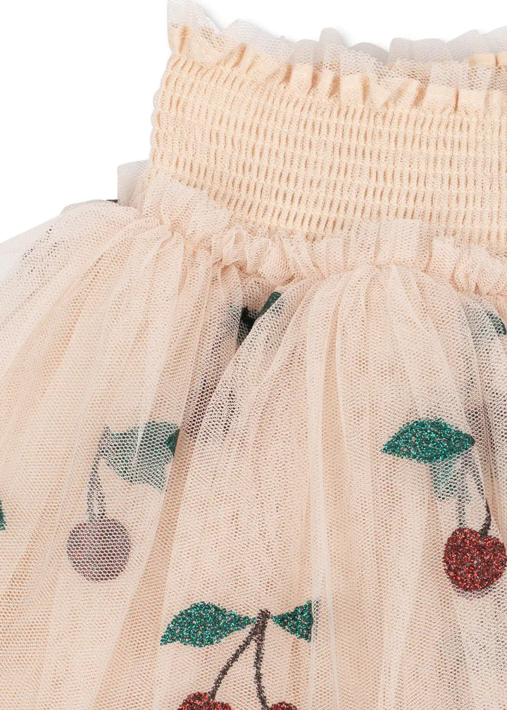 Konges Slojd Tullie Smock Skirt GRS ma grande cerise glitter Detailansicht gesmokter, flexibler Bund und Glitzerkirschen. 