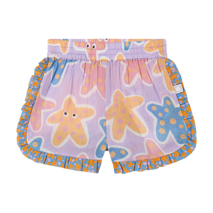 bunte Baumwollvoile Shorts für Baby-Mädchen mit Seesternmuster in violett, gelb, blau und rosa, Gummibund und bunter Volantstreifen am Beinabschluss und an der Seite