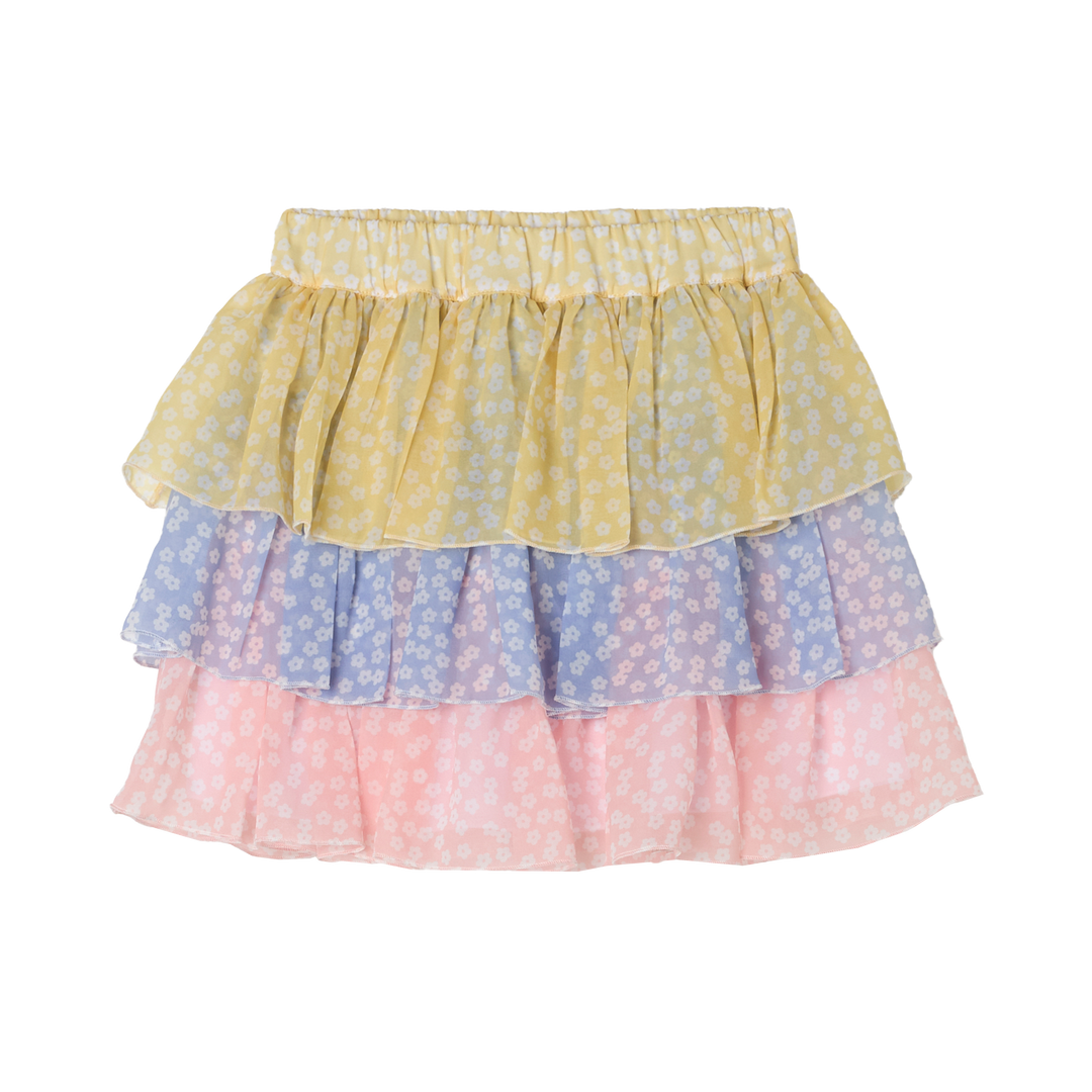 bunter Stufenrock für Mädchen aus Polyester mit einer gelben, blauen und rosafarbenen Stufe mit weißen Blümchen und Gummibund. Unterrock aus 100% Baumwolle. Produktbild